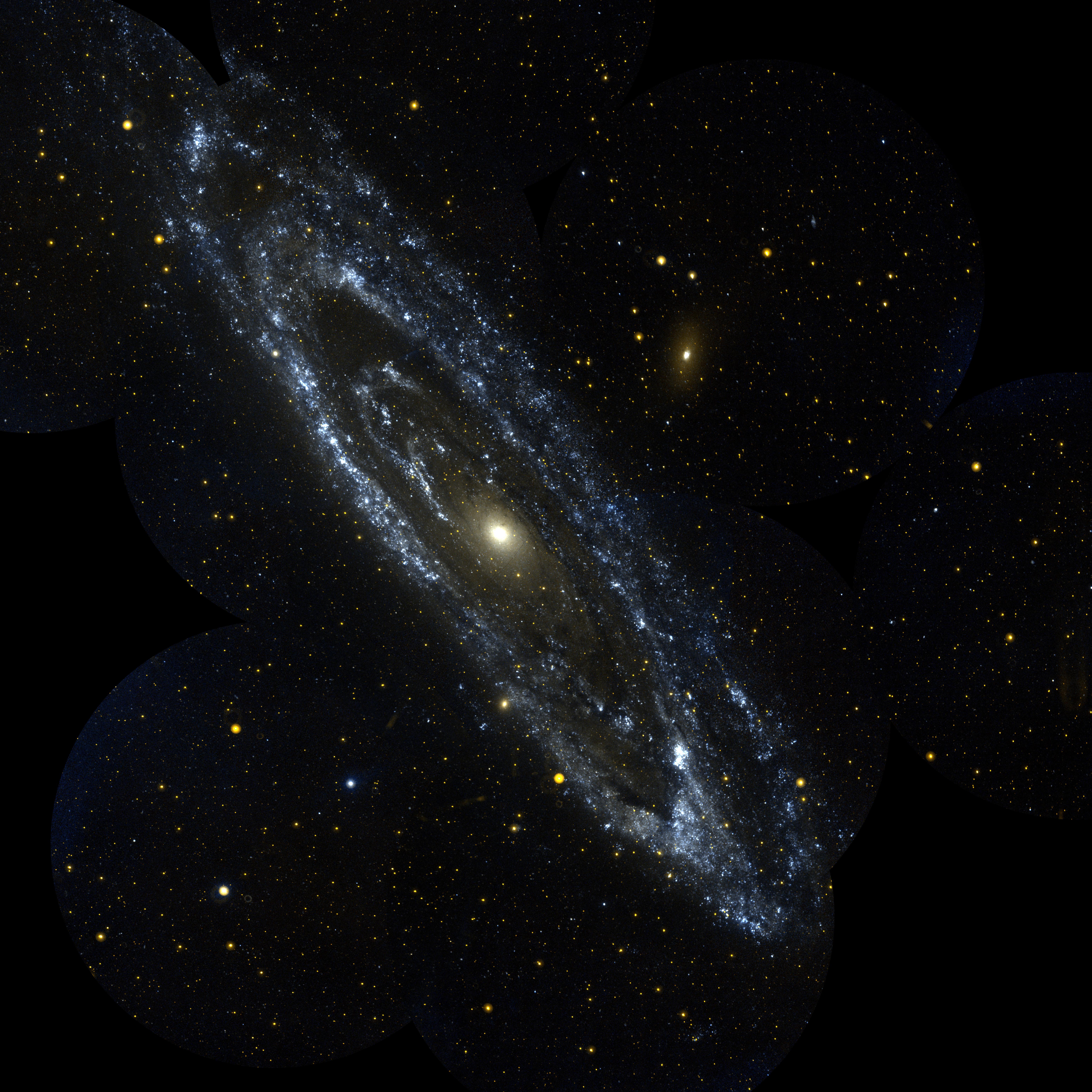 The Andromeda Galaxy as seen through a moderate telescope — a bright elongated core surrounded by spiral arms against a dark sky