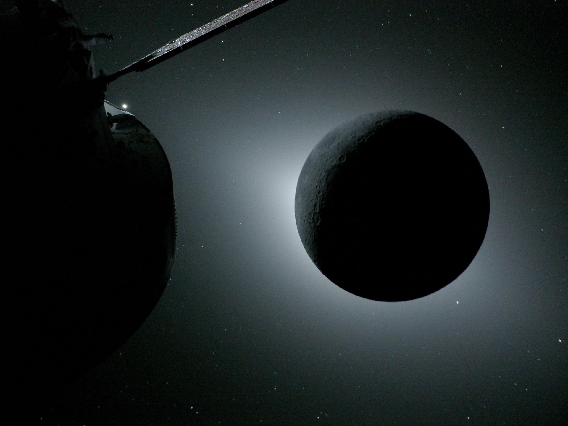 The dark Moon backlit by the Sun during the solar eclipse seen from NASA's Orion spacecraft on April 6, 2026, with part of Orion in the foreground. During this eclipse the Artemis II crew saw meteoroid impact flashes