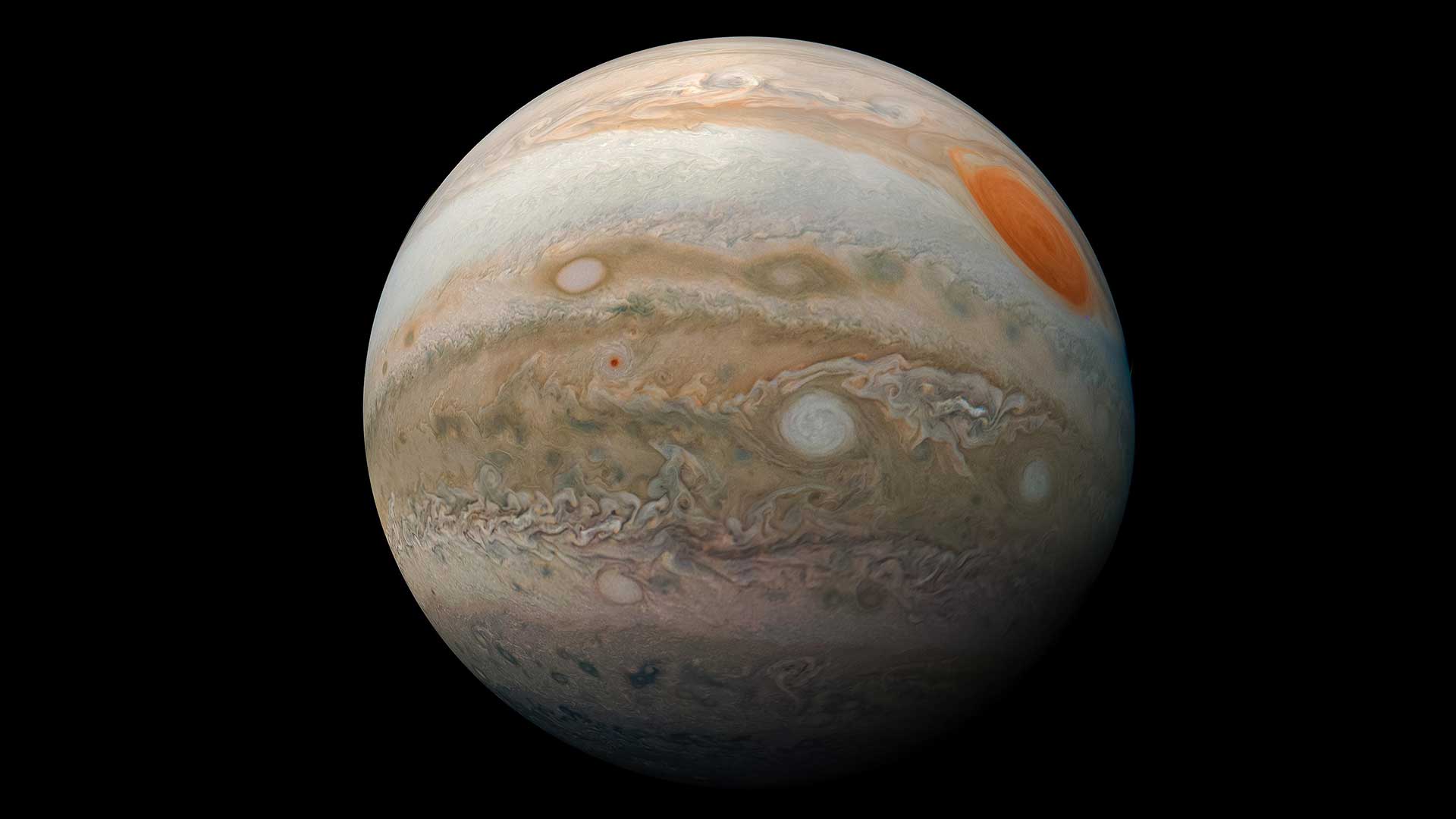 Jupiter — full marble portrait showing the Great Red Spot and colorful banded cloud structure from NASA's Juno spacecraft
