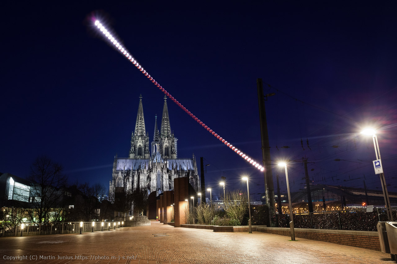 Total lunar eclipse blood moon glowing deep red over Cologne Cathedral, Germany — January 20–21, 2019 Super Blood Wolf Moon Eclipse