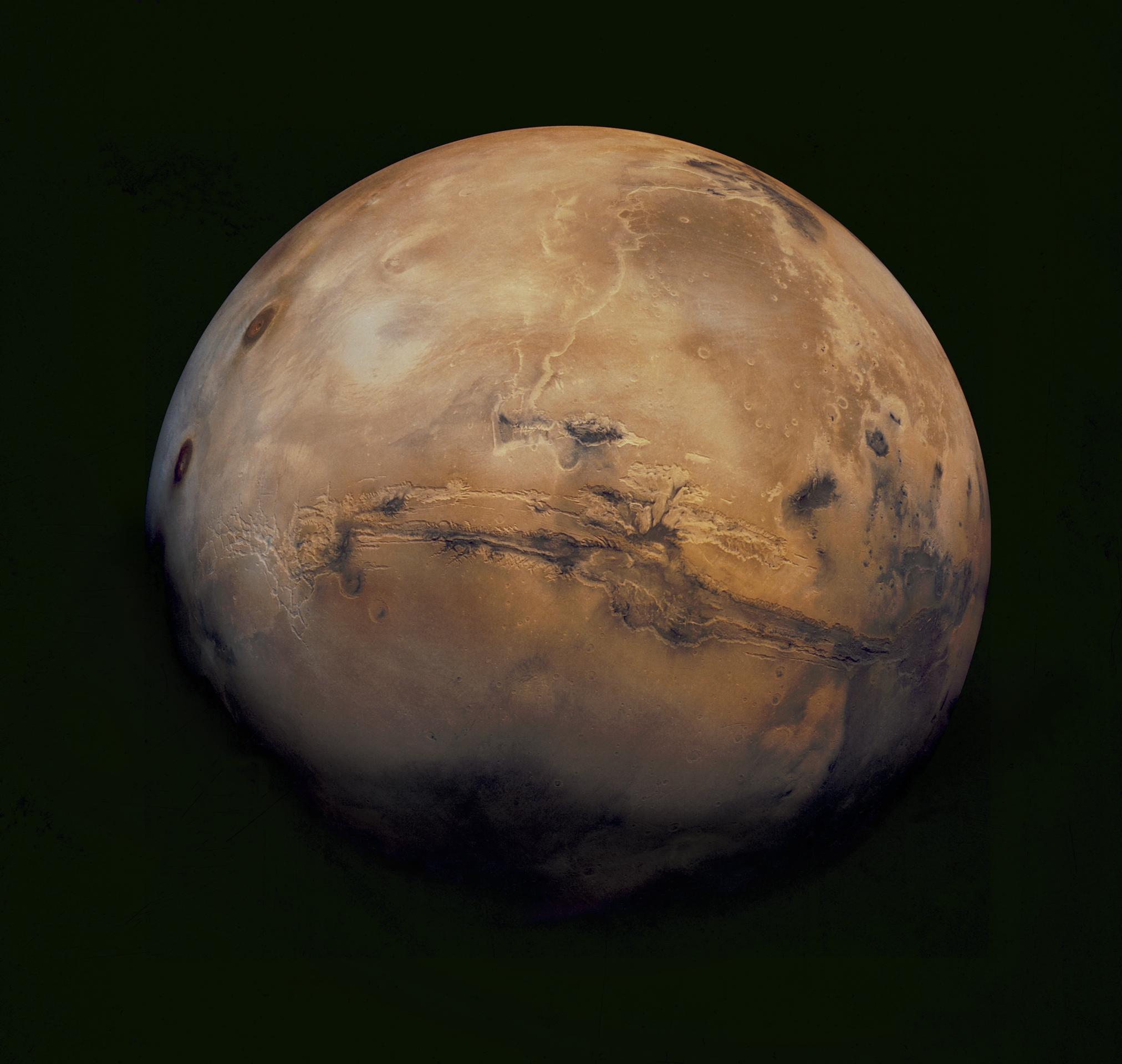Mars — full globe of the Red Planet showing the massive Schiaparelli crater and rust-colored surface