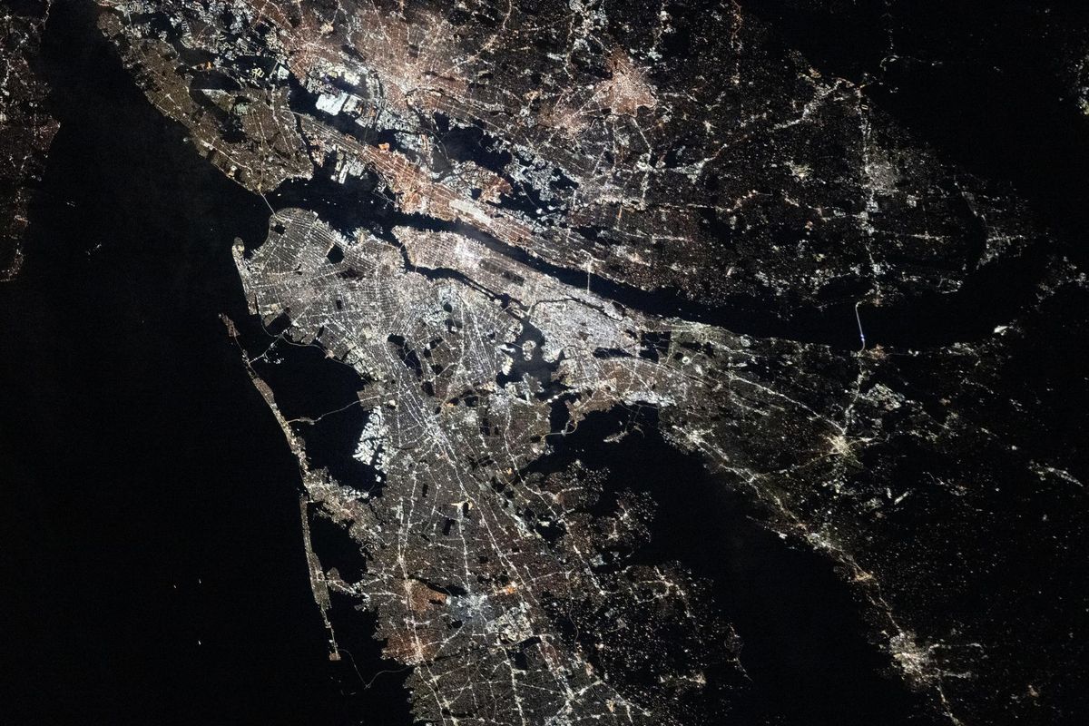 The New York, Newark and Jersey City metropolitan area at night from the International Space Station, December 2025, with Manhattan a bright bar at centre
