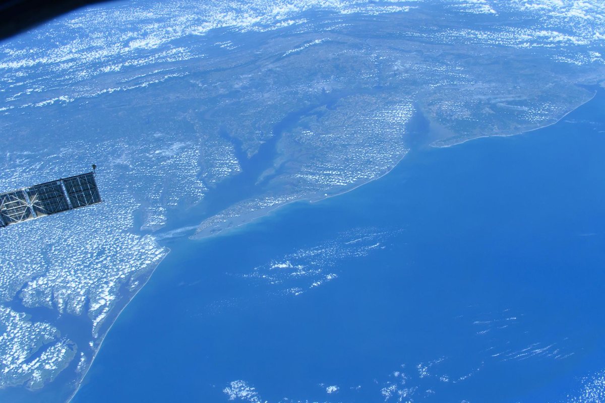 Delaware Bay and the Chesapeake Bay on either side of the Delmarva Peninsula, with the forests of southern New Jersey across the bay, photographed from the International Space Station