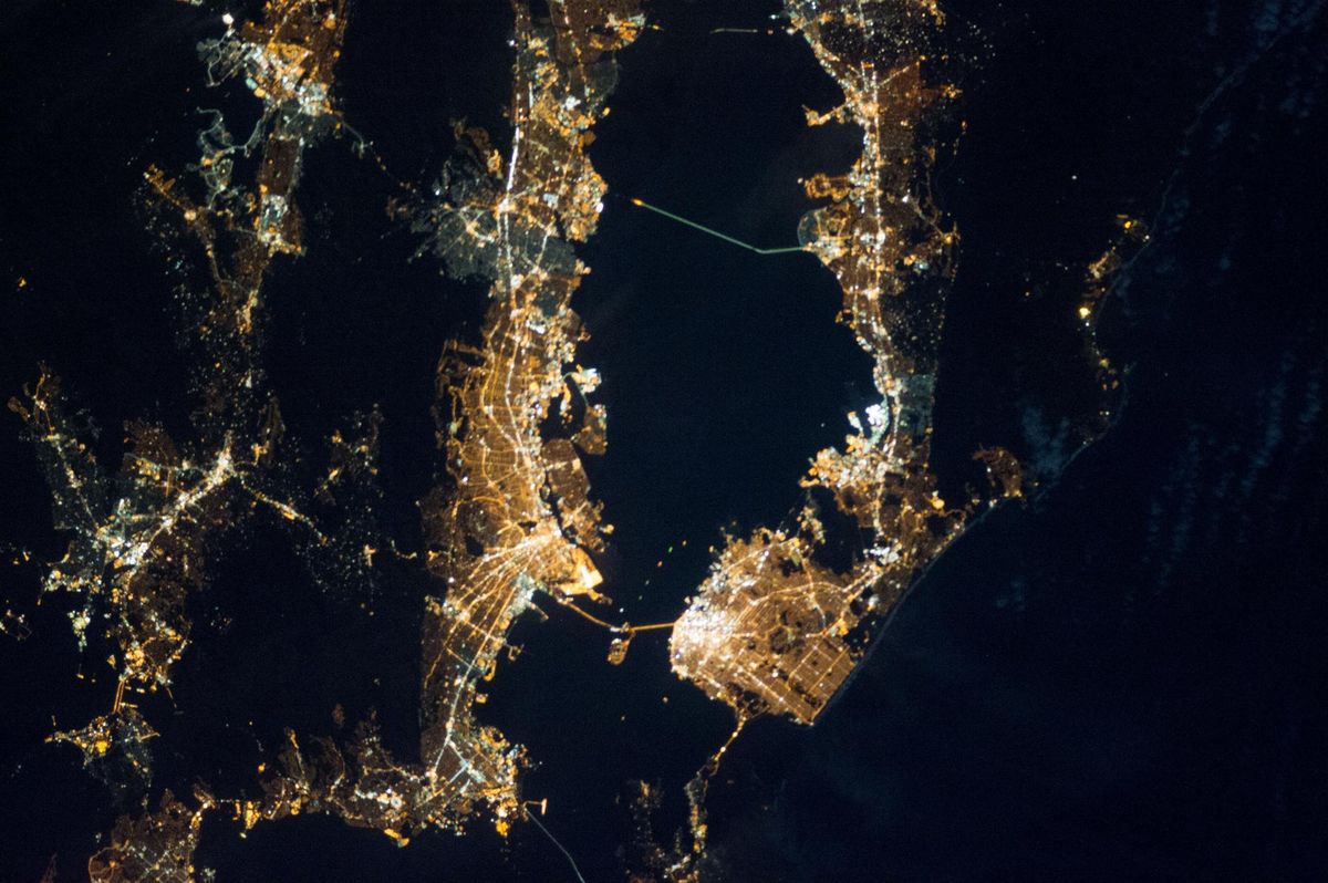 The San Francisco Bay Area at night from the International Space Station, the cities forming a ring of light around the dark bay