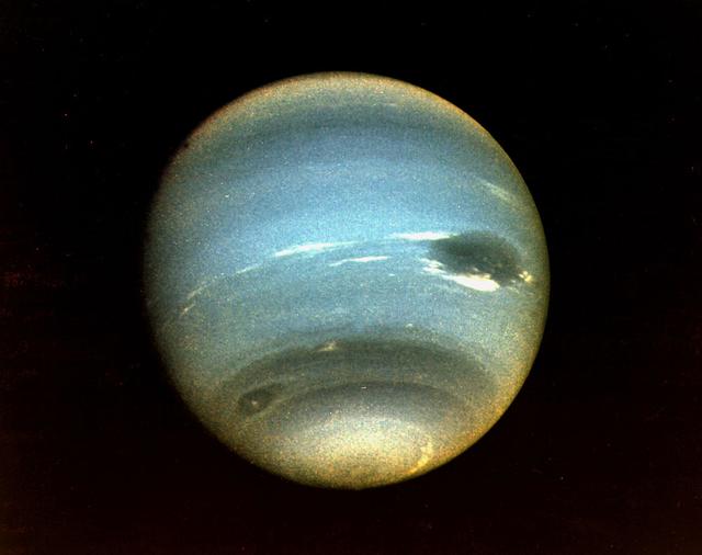 Neptune photographed by Voyager 2 spacecraft in 1989 showing its deep blue colour and cloud features