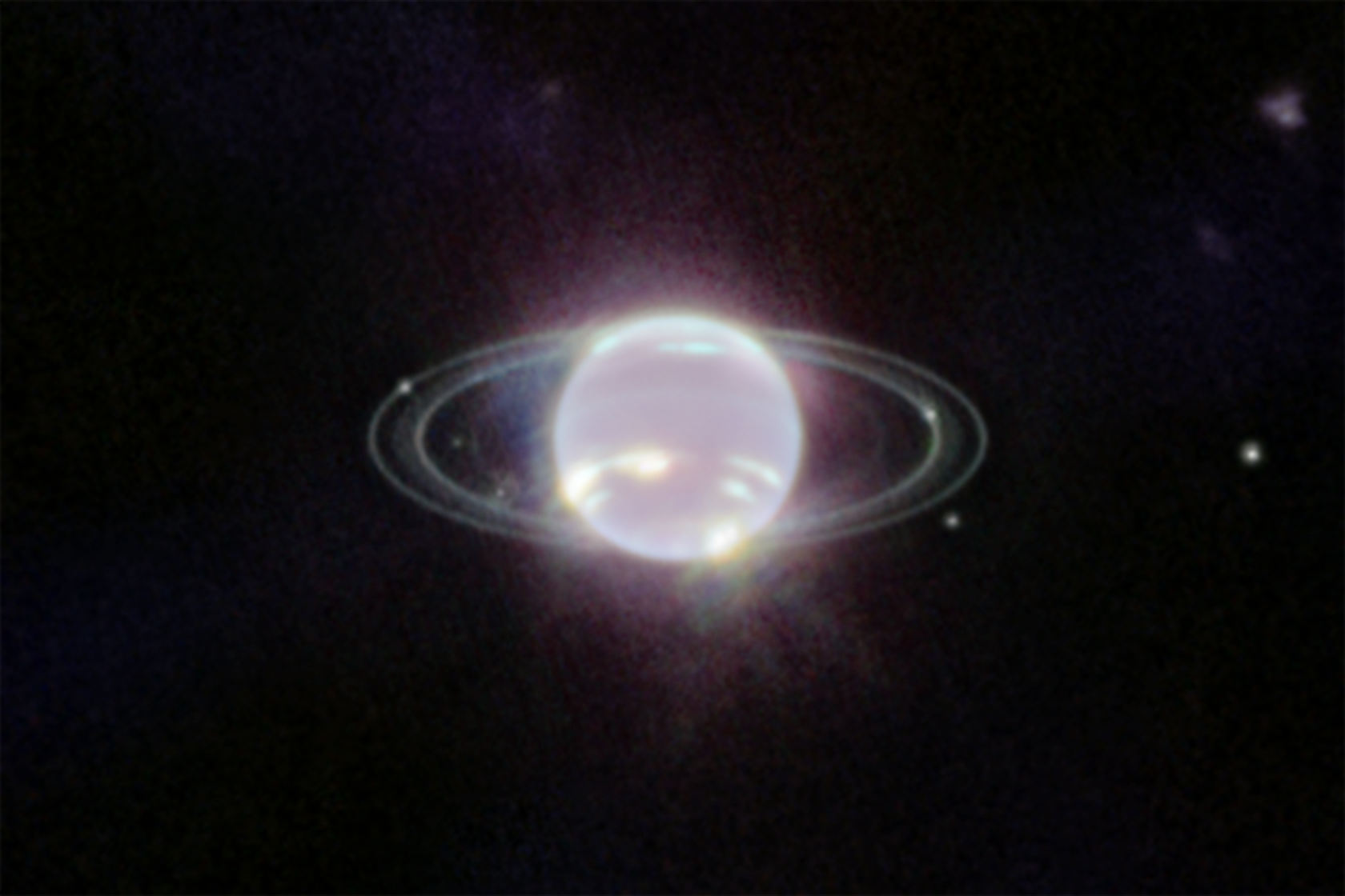 Webb close-up image of Neptune showing bright methane-ice clouds and faint rings