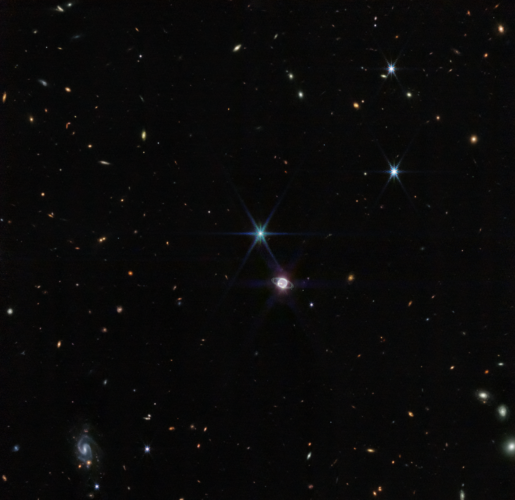 James Webb Space Telescope wide-field view of Neptune with Triton, faint rings, and background galaxies