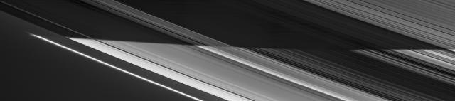 Saturn photographed by NASA Cassini spacecraft showing rings and multiple moons